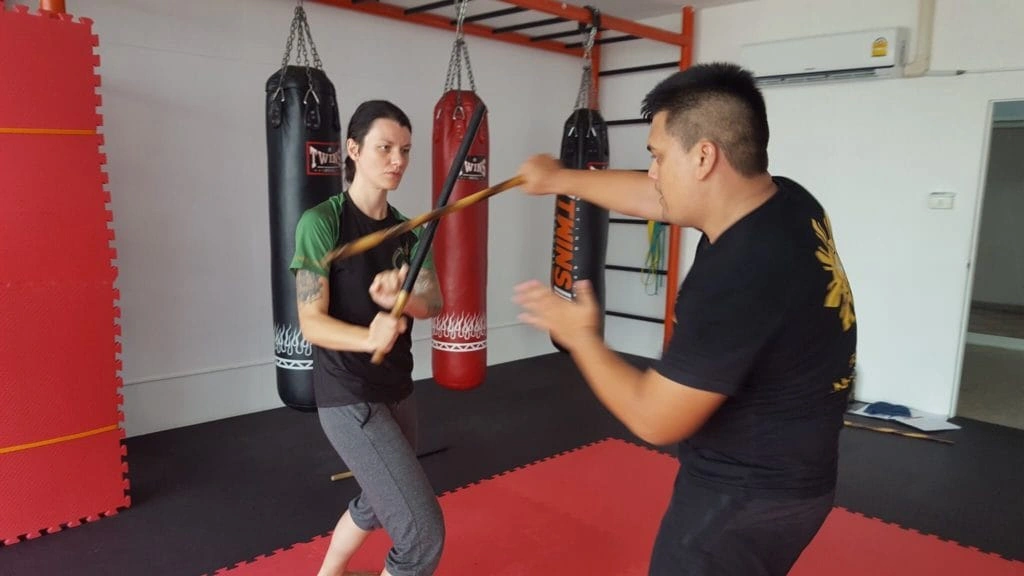 CMLocals Chiang Mai Locals Emergency Self-Defence ED Visa female student practicing self-defence techniques with training sticks